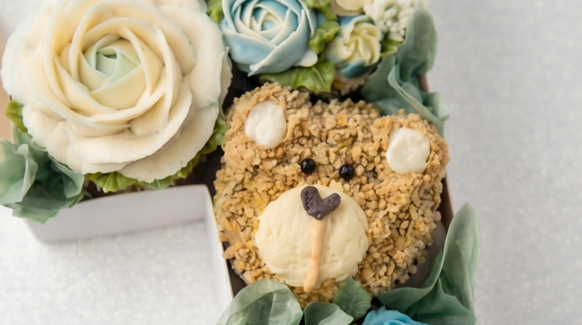 Close-up of floral piping detail on number box cupcakes